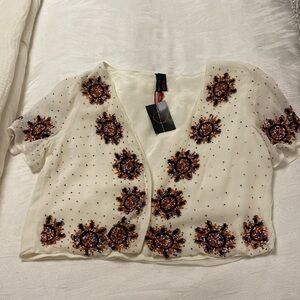 Raga hand beaded to brand new with tags color is off white so pretty